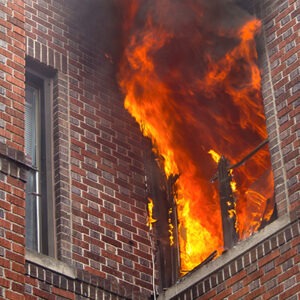 vertical-shot-of-a-burning-apartment-in-a-building-2023-11-27-05-08-22-utc
