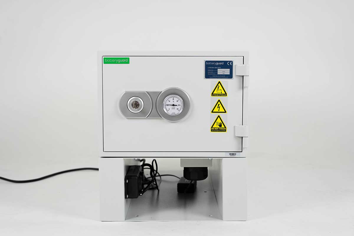 BatteryGuard M-1 lithium battery safety cabinet with pressure gauge and warning labels.